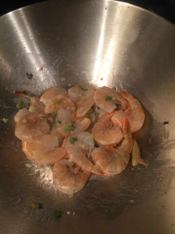 12 shrimps in stainless steel wok