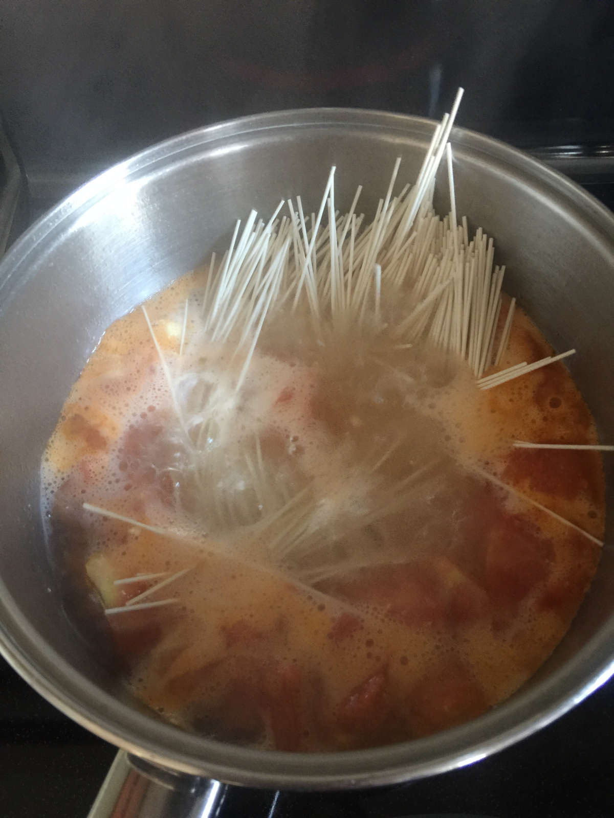 thin noodles cooked in boiling water in pot