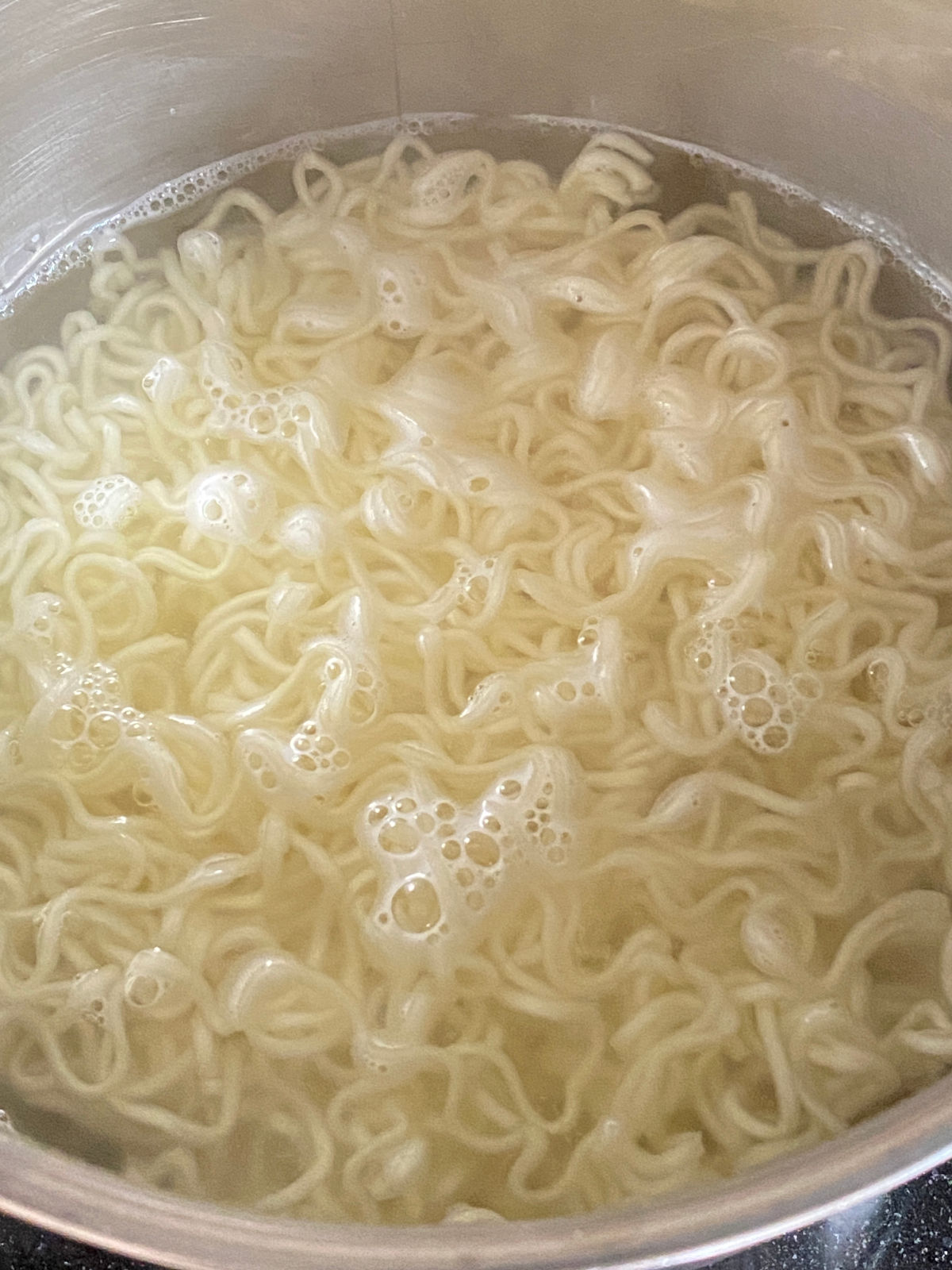 Boiling instant noodles in the pot.
